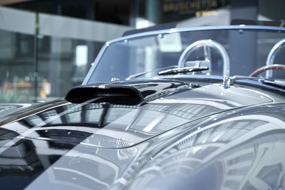 Luxury car showing brilliant mirror finish after detailing